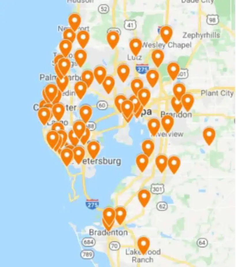 Map of the Tampa Bay area with many orange location pins clustered around Tampa, St. Petersburg, Clearwater, and Bradenton.
