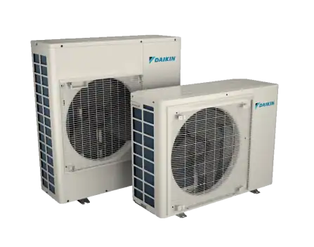 Two Daikin outdoor air conditioning units of different sizes are positioned side by side on a plain background.